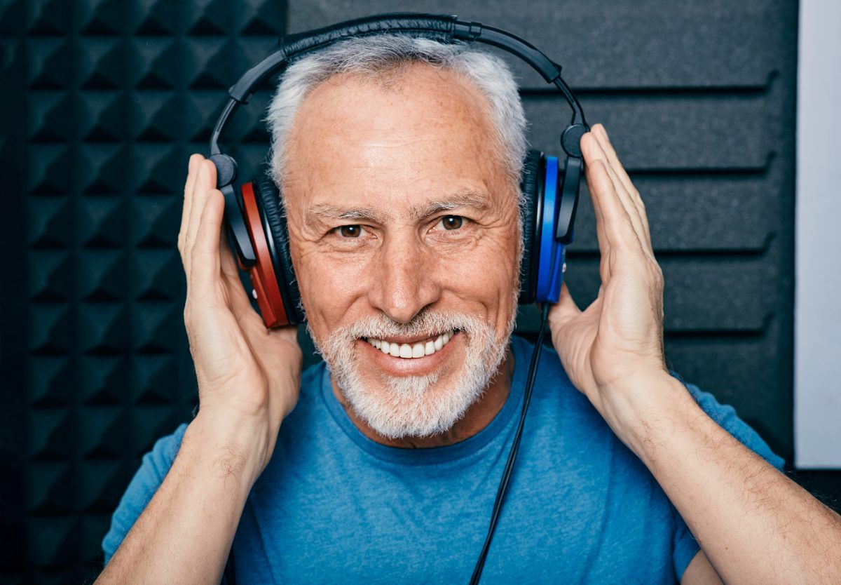 A man smiling during a hearing assessment